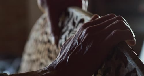 Close up of a carpenter while he is checking the quality of the wood. Concept: Work, wood, carpent