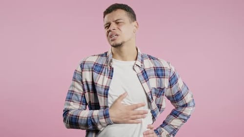 Man Squeezing Belly with Hands Because of Abdominal Pain Adult Guy Suffering From Stomach Ache