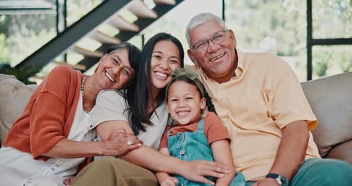 Smiling Family Portrait on Couch at Home