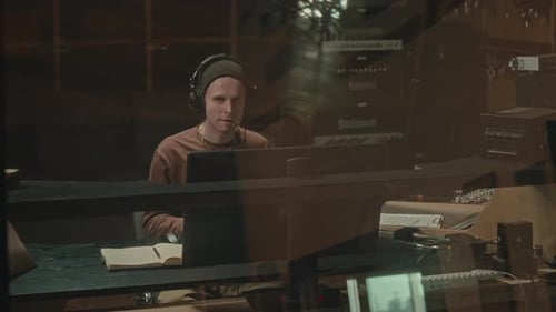 Record Producer Making Music in Studio