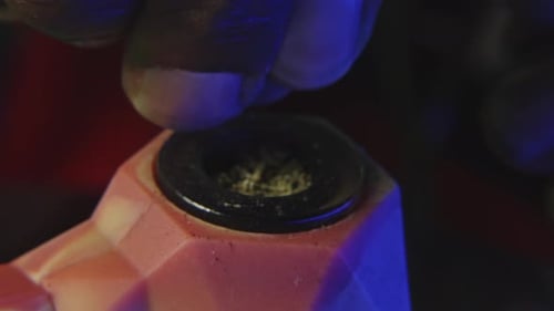 Fingers Pressing Down into Granular Substance
