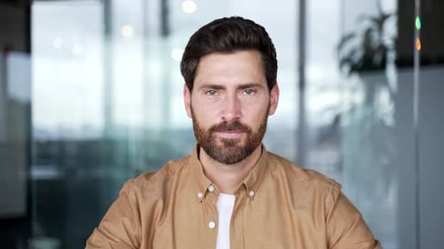 Webcam view. Confident businessman watching video call conference looking at camera while sitting