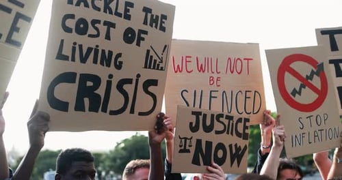 Group of diverse people protest against inflation and financial crisis - Protesters marching