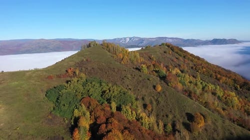 Aerial view of fog in the valley, morning haze at autumn
