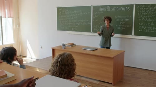 Teacher Lecturing Students in Classroom