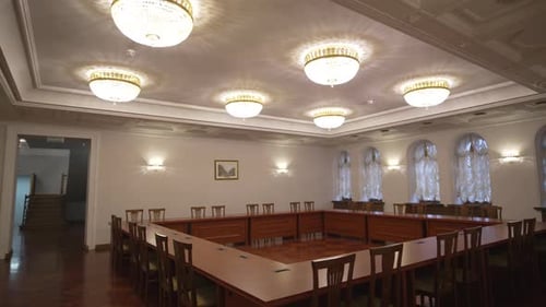 Meeting Room with Tables Arranged Neatly in Square Shape