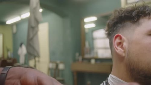 Man Gets Haircut at a Barber Shop