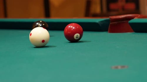 Closeup of Person Playing Pool Shooting Solid Brown 7 Ball Hard into the Side Pocket after Practice