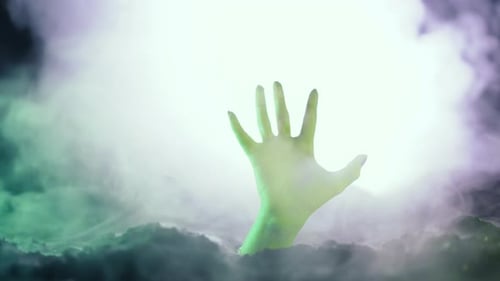 Horrible Zombie Hand Emerges From Grave on Cemetery Undead Looking for Victim