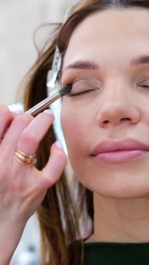 Close Up Eyes Makeup Make Up in Process Beautician Applies Makeup Eyeshadows in Bright Professional