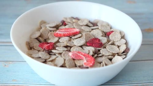 Bowl of Cereal with Strawberries and Milk