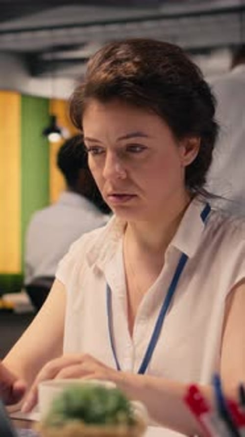 Vertical Video Anxious Businesswoman Under Intense Work Pressure at Office Desk