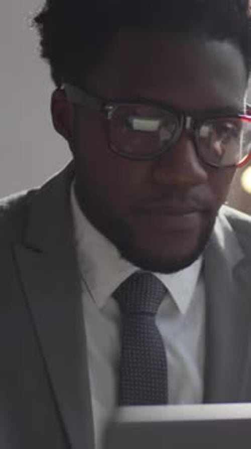 Young Adult Working on Tablet, Smiling