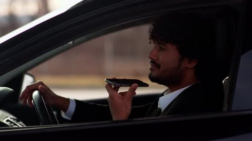 Man Talking on Phone in Car, Mid Shot