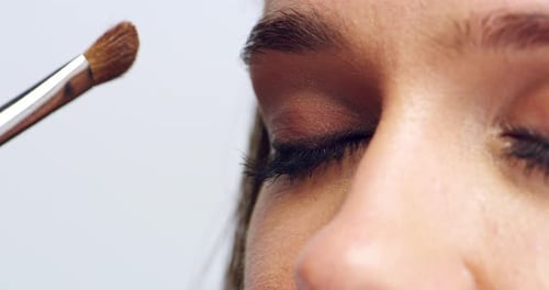 4k video footage of a woman having eyeshadow applied