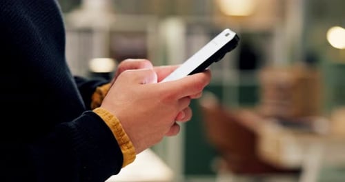 Hands, phone and texting at startup, office and night with contact for deal, networking or chat