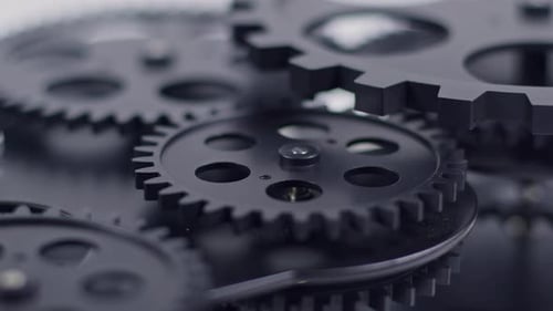Dark Metallic Gears Turning in Slow Motion