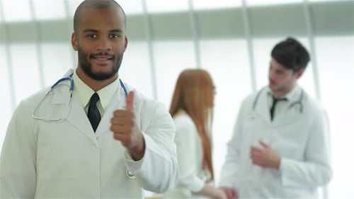 Doctor Gives Thumbs Up in Hospital Setting