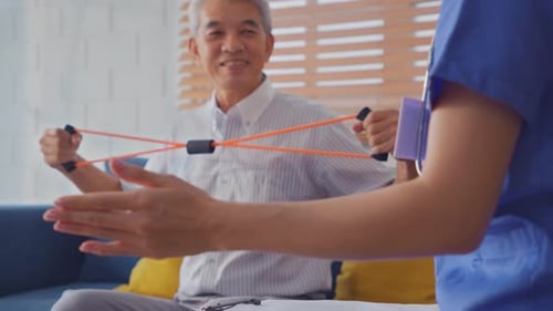 Senior Man Doing Arm Exercises at Home