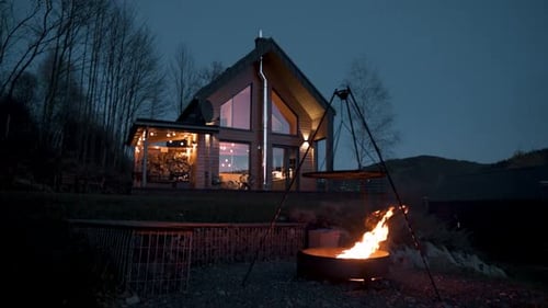 Cozy Cabin with Fire Pit at Night