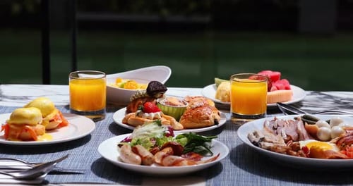 Assortment of breakfast foods with orange juice