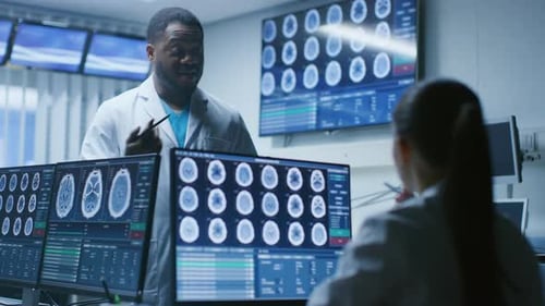 Medical Professionals Discuss Brain Scans in Hospital Room