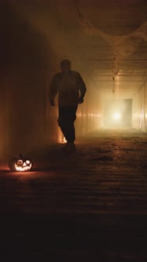 Spooky Figure Walks Through Dark Halloween Tunnel