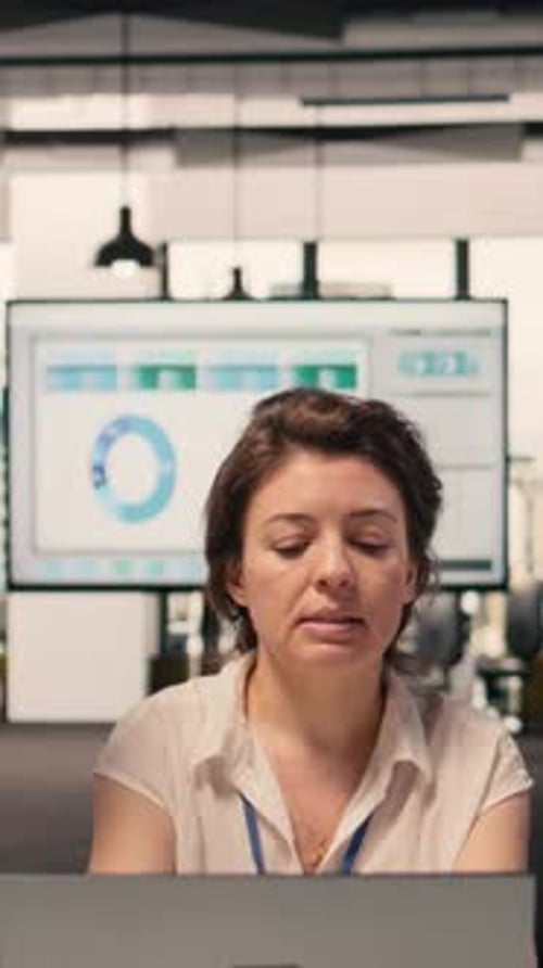 Vertical Video Diverse Corporate Team Meeting Focused on Strategy Planning and Visual Data