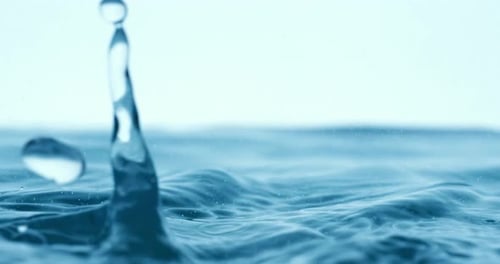 Rain water drops falling in super slow motion.
