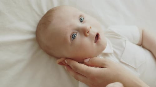 Beautiful Baby Lying on Blanket