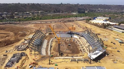 Stadium construction with crane. Drone forward.