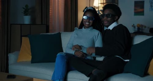 Couple Reacting to 3D Movie at Home