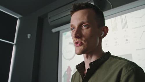 Man Giving Presentation during Business Meeting in Office