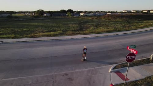 Onewheel Rider on Street in Suburban Neighborhood