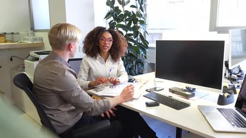 Business Meeting Coworkers Discussing Strategy in Modern Office