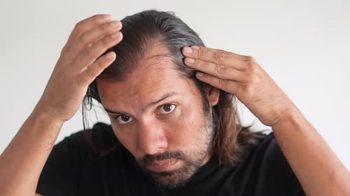 Man Running Hands Through Hair Close Up