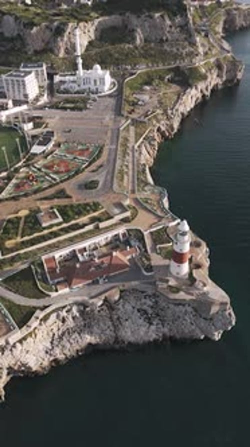 Aerial Pan Over Europa Point Lighthouse and Gibraltar Landscape