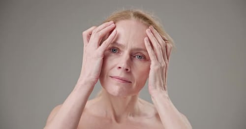 Woman Massaging Face for Skincare Beauty