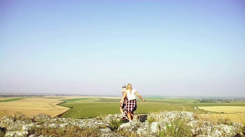 Young Couple Hiking on the Mountain