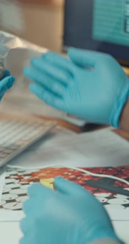 Evidence Analysis: Gloves Examining Exhibit at Forensic Lab