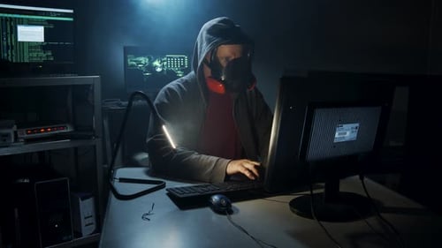 Bio-Terrorist hacker types computer code.