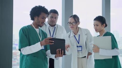 Team of Doctors Communicating at Hall of Hospital