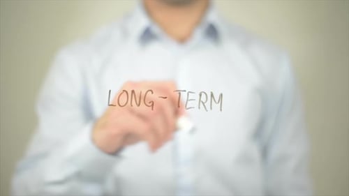 Long Term, Man Writing on Transparent Screen