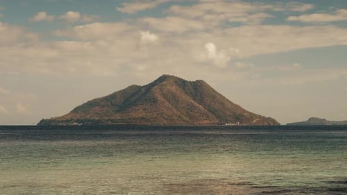 Timelapse of the Clouds Forming Over the Mountain Covered with Tropical Forest and Sea on the