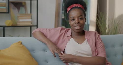 Adult Woman Smiles in Home Living Room