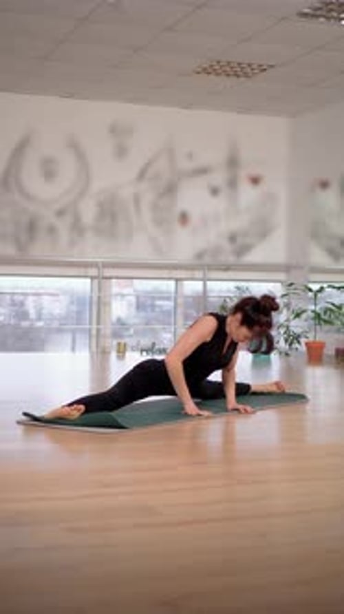 Woman Doing Splits Stretch on Yoga Mat