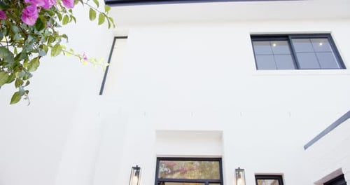 Modern Home Exterior with White Facade and Bicycle