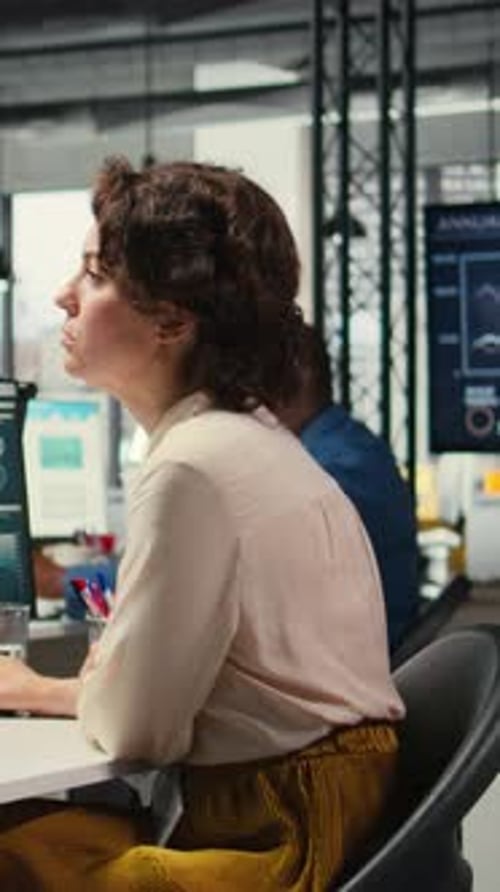 Vertical Video Female Advisor in Workstation Thinking About a New Strategy to Increase Profit