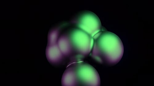 Abstrakte Kugeln aus grünen und violetten Kugeln, die auf schwarzem Hintergrund pulsieren