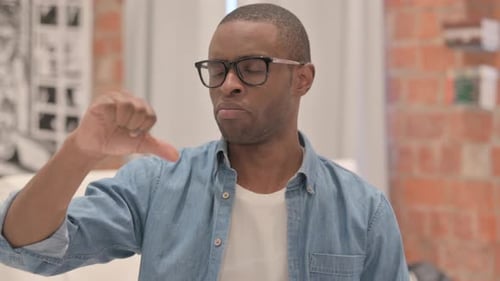 Portrait of Businessman Doing Thumbs Down